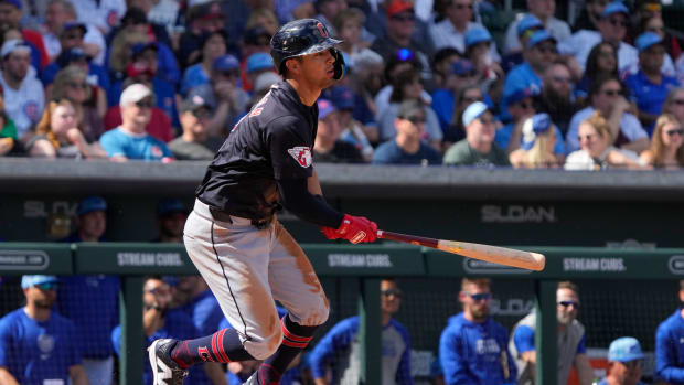 Mar 3, 2024; Mesa, Arizona, USA; Cleveland Guardians third baseman Tyler Freeman (2) hits an RBI single against the Chicago Cubs in the second inning at Sloan Park.